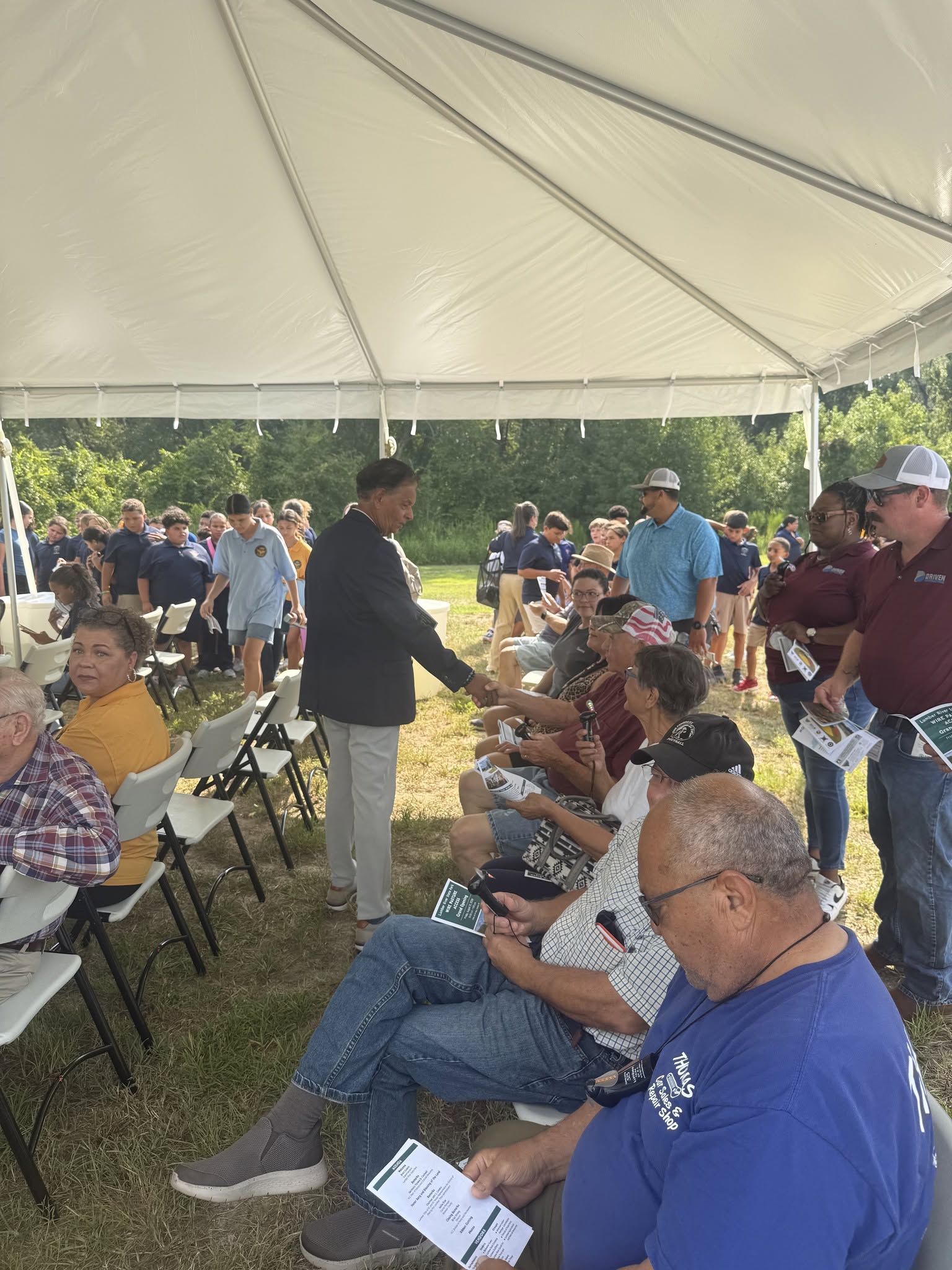 Charles Graham greets community members at a Robeson County gathering
